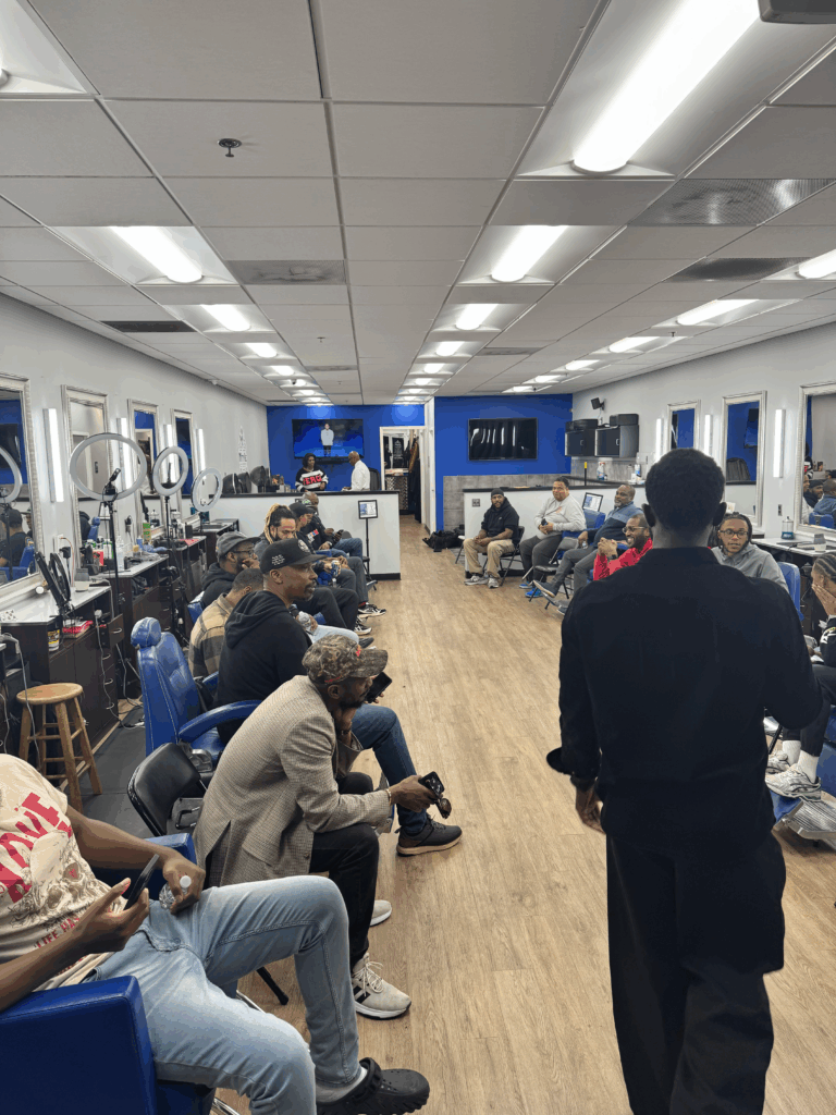 Men gathered at N'Style shop discussing grief and depression at October's Shop Talk