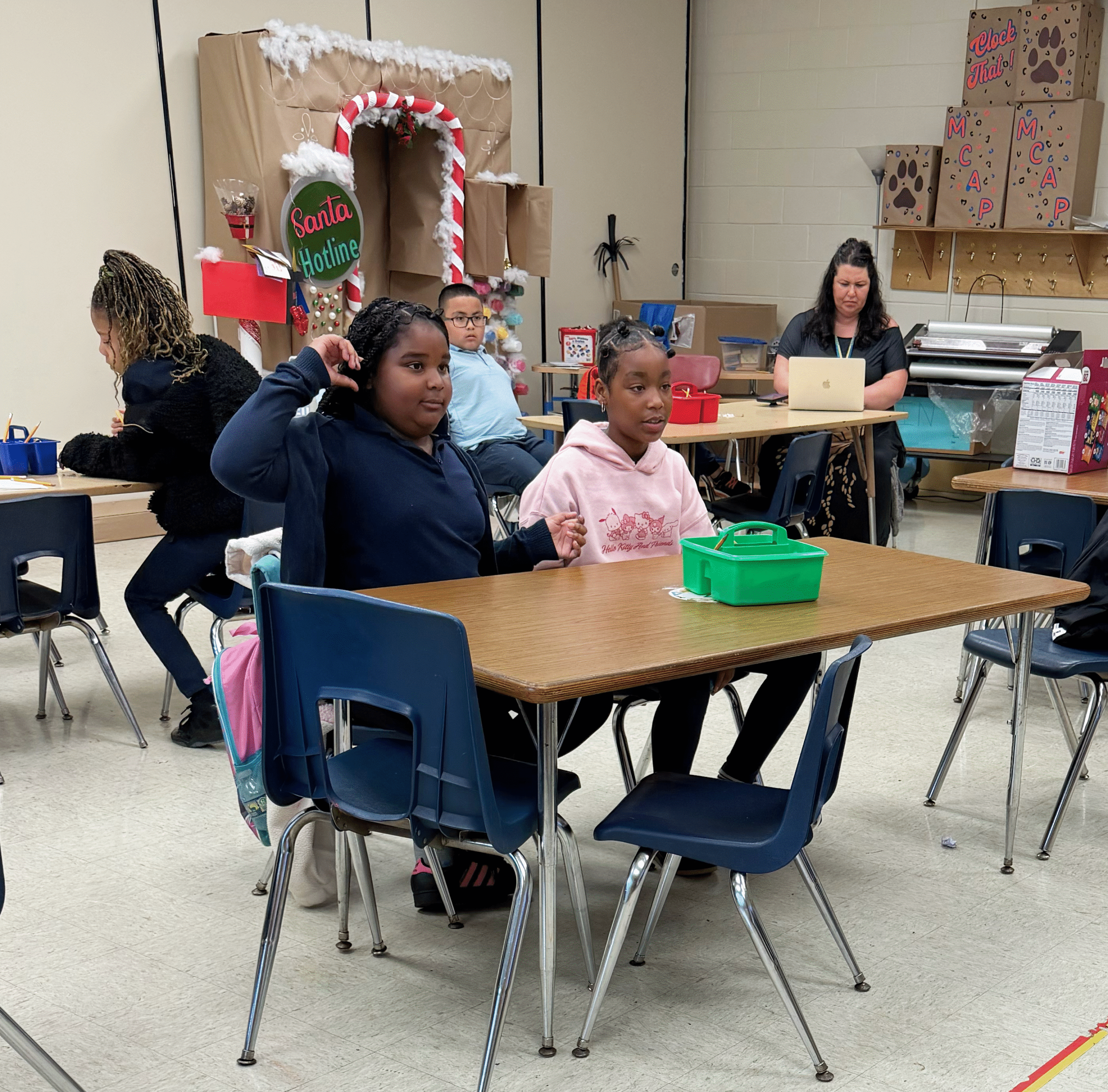 student raising her hand